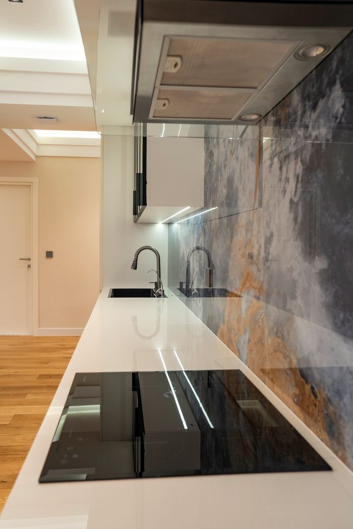 Sleek and modern kitchen with minimalist design and contemporary appliances.